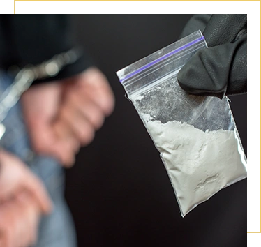 Police arrest drug trafficker with handcuffs