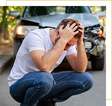 Young white man driver in car accident