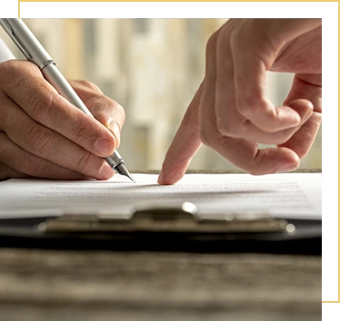 Closeup of businessman showing his new business partner where to sign an agreement