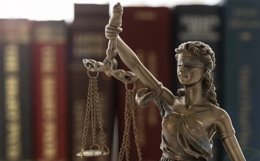 Lady of justice with law books