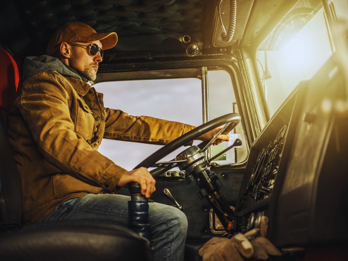 Truck driver on the road, highlighting the need for a traffic ticket lawyer in California for CDL violations.