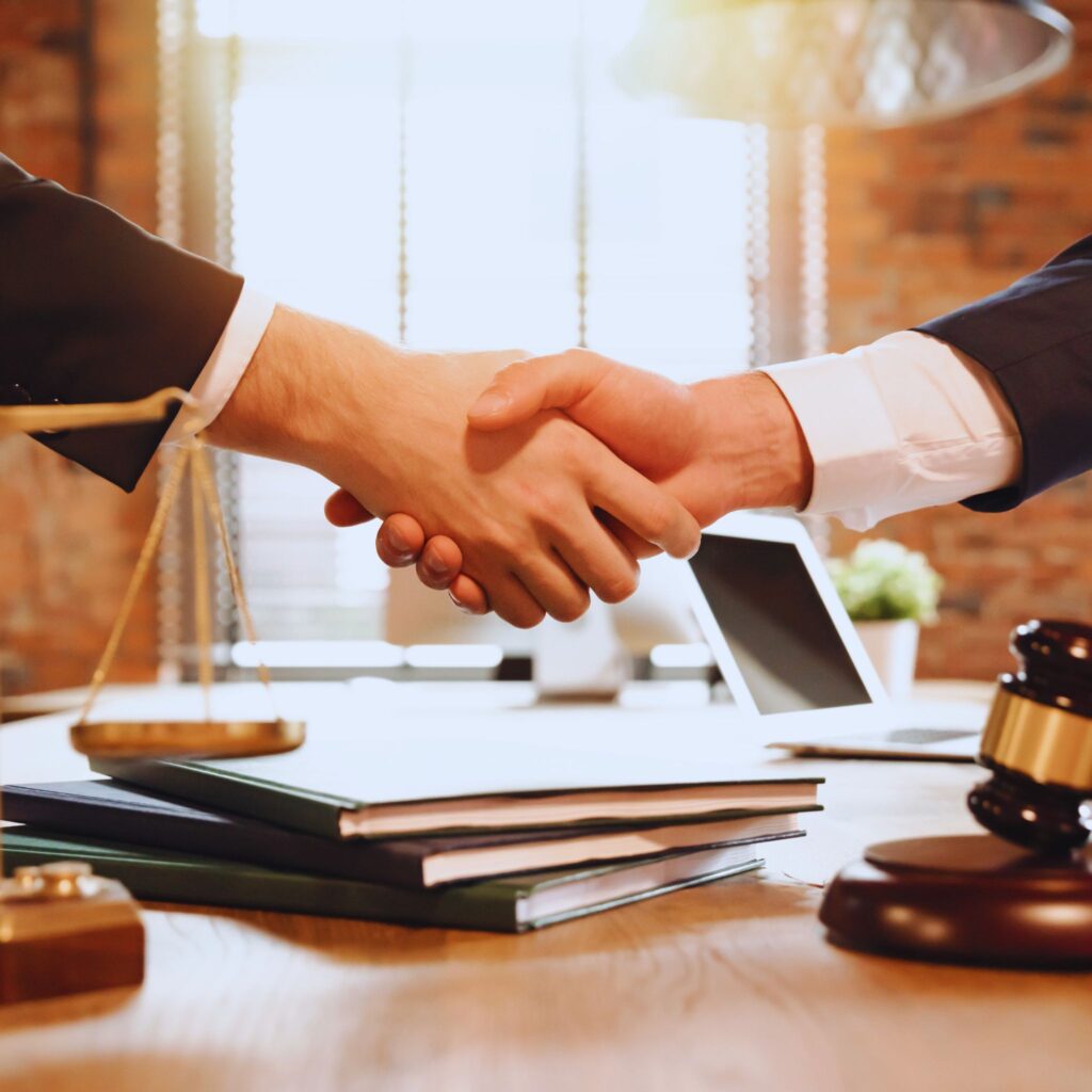 California Criminal Defense Lawyer for Domestic Violence shaking hands with a client.