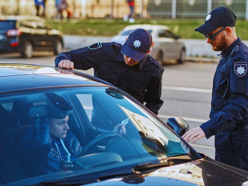 Suspended license in Southern California: A driver holding a suspended license notice. Get legal help from our experienced attorney!