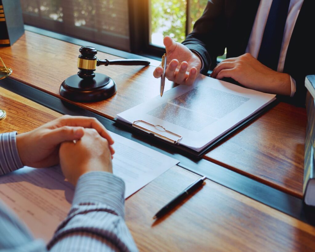 "A client in consultation with a lawyer discussing expungement options.