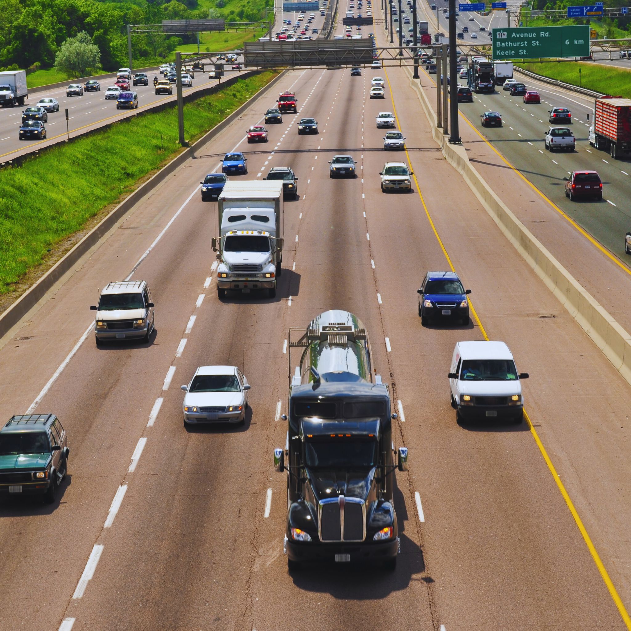 DUI charges in California: The image shows a busy road filled with a variety of vehicles in motion, emphasizing the importance of safe driving and adherence to traffic laws to prevent legal issues.