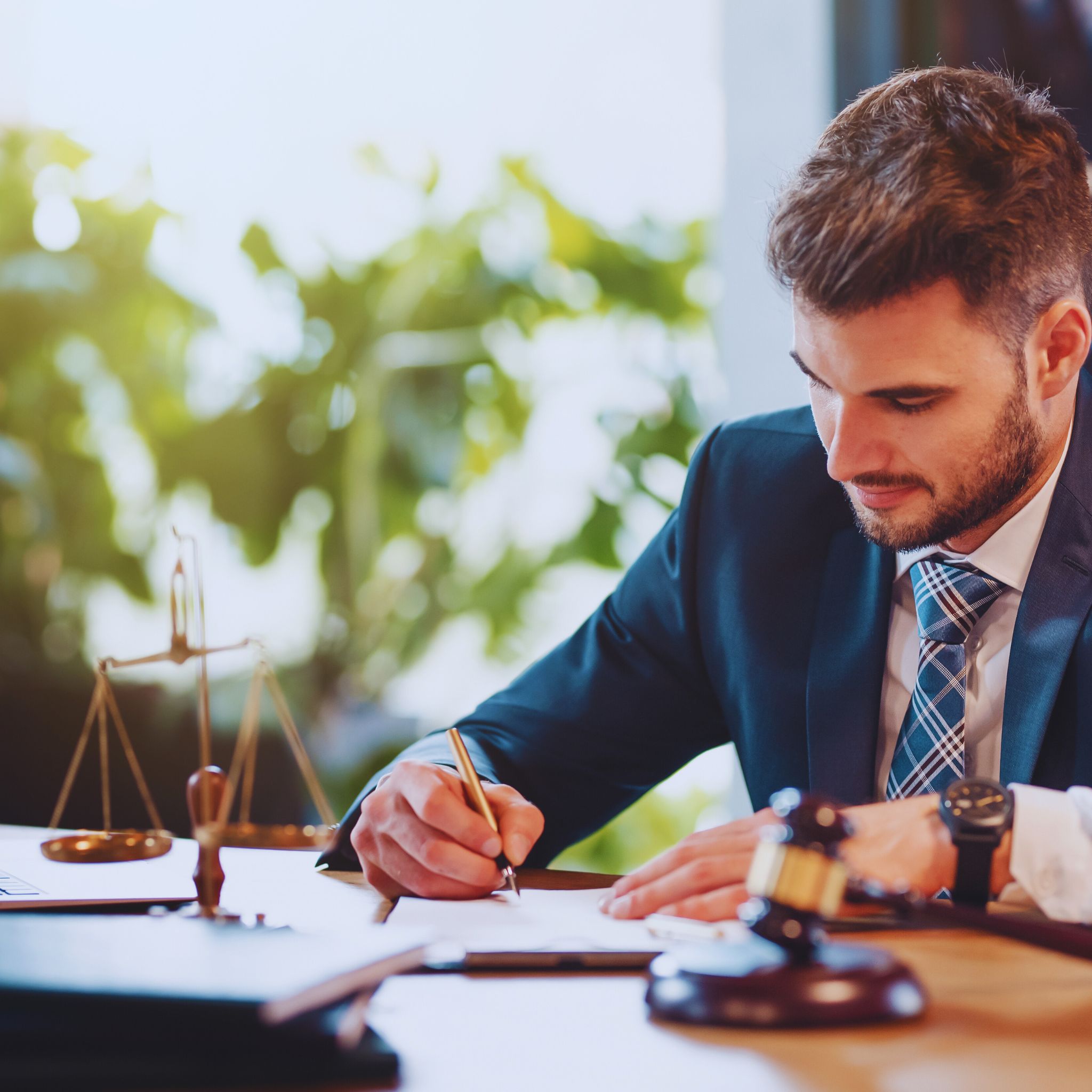 DUI attorney working, reviewing documents, and preparing for appealing a DMV hearing decision.