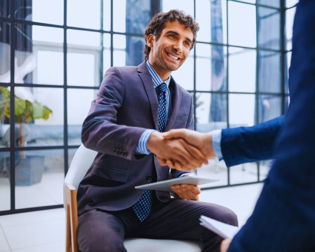 "A man shaking hands with an attorney after discussing expungement options.